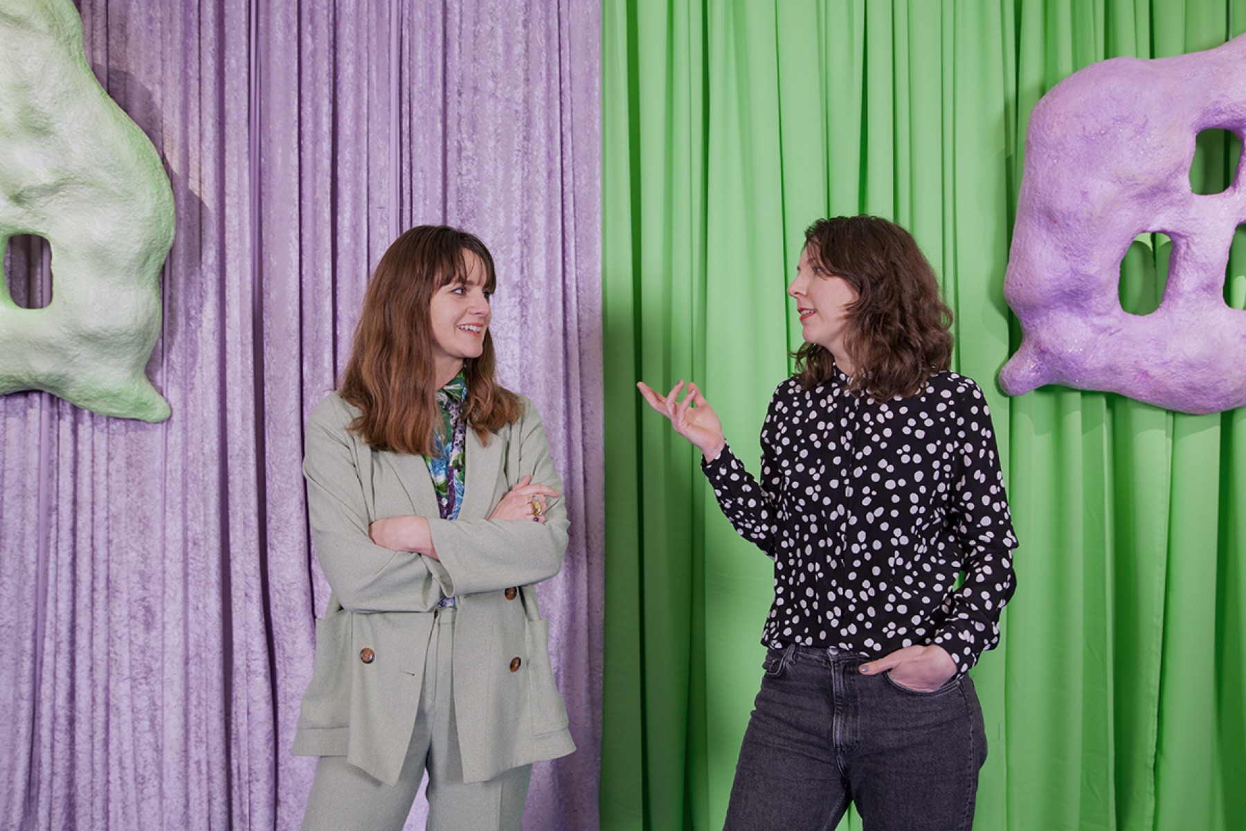 Two people in conversation at MOTHERBOARD