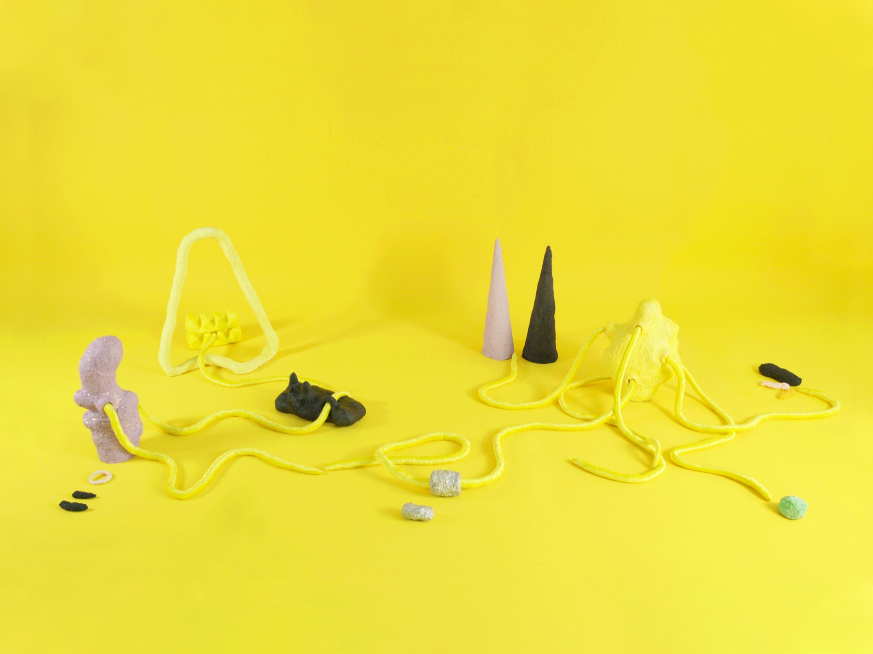 A warm yellow-toned installation room — Wicked Futures / Board of Imagination